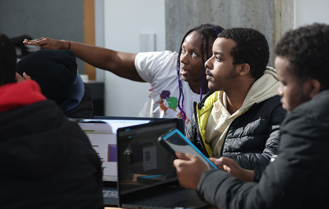 MIT undergrad Gisella Kakoti helps troubleshoot an AI app.