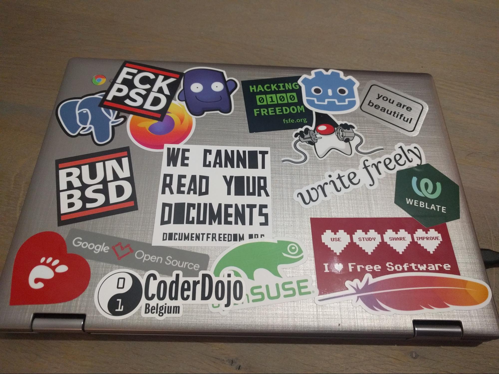 A laptop with many stickers